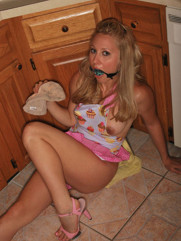 Gagged Bimbo Rachel Sexton Is Fooling Around In Dress And Half Nude In The Kitchen