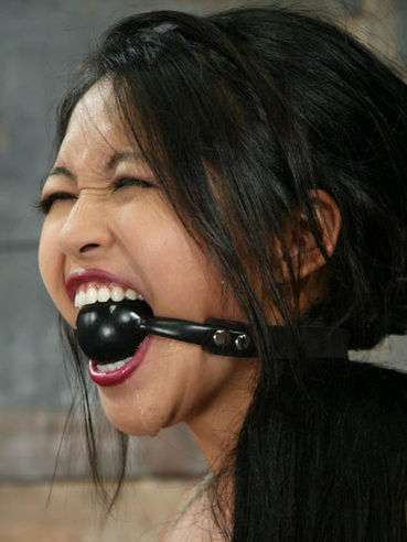 Asian Slave Mika Tan Gets Her Body Tied, Her Mouth Ball Gagged And Her Tits Tortured By Sebastia