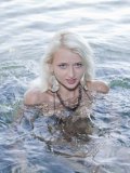 Nika N Is A Stunning Blonde Teen Who Is Stripping At The Beach And Touching Herself